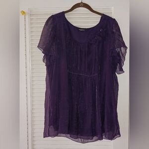 1x purple sheer blouse with shell and flower detail